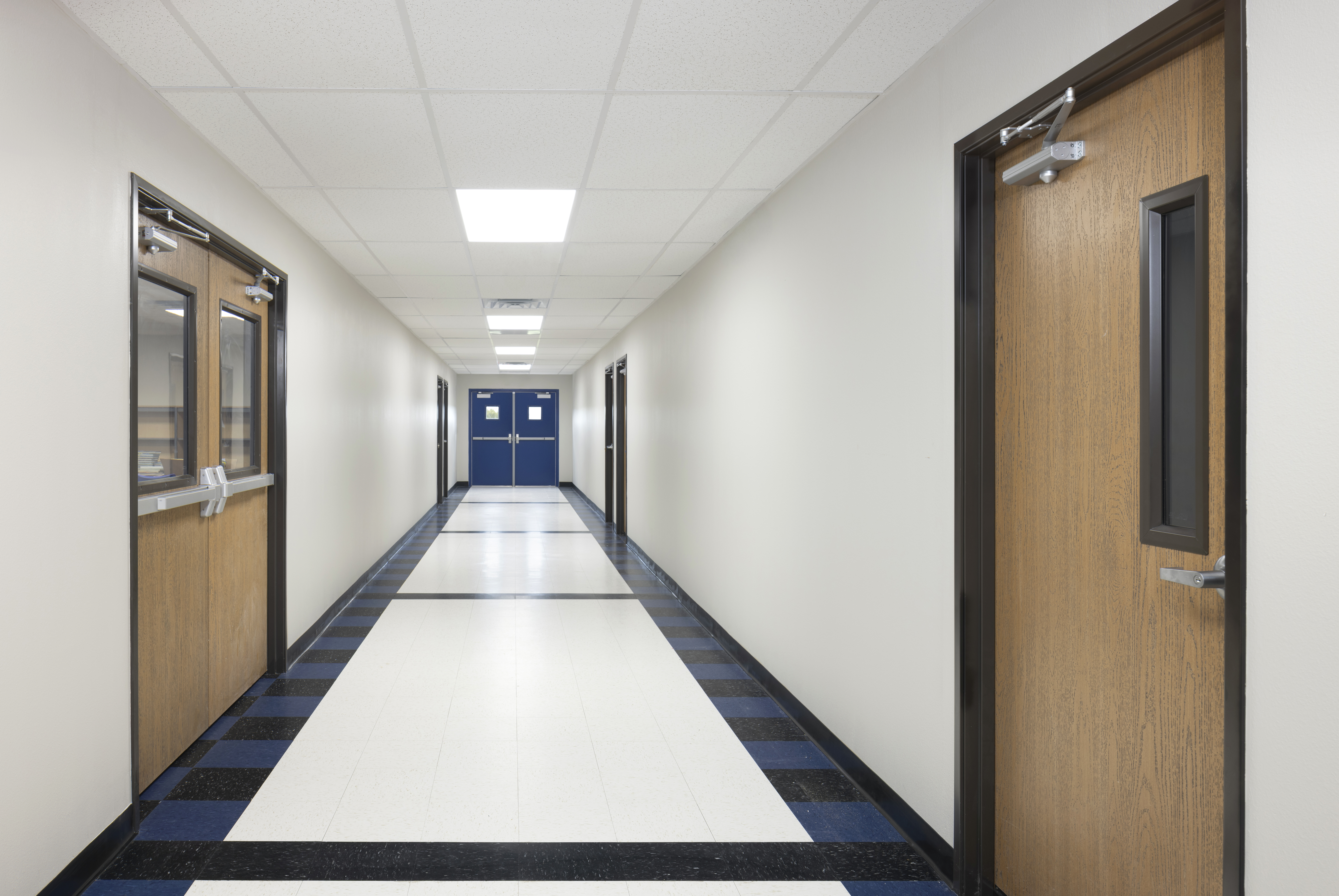 Interior corridor featuring patterned VCT flooring in the Westhoff ISD modular facility